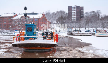 Turku, Finland - January 17, 2016: Ordinary passengers float on city boat Fori, light traffic ferry that has served Aura River Stock Photo