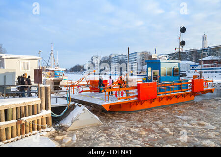 Turku, Finland - January 22, 2016: Ordinary passengers and city boat Fori, light traffic ferry that has served the Aura River Stock Photo