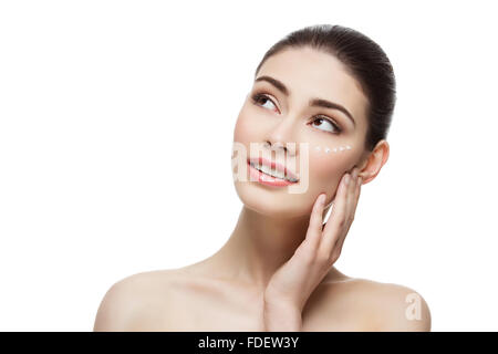 Girl with cream dots on face Stock Photo