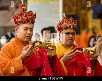 Bangkok, Bangkok, Thailand. 31st Jan, 2016. Mahayana Buddhist monks participate in a prayer service before Chinese New Year at Wat Mangon Kamlawat, the largest Mahayana (Chinese) Buddhist temple in Bangkok. Thailand has the largest overseas Chinese population in the world; about 14 percent of Thais are of Chinese ancestry and some Chinese holidays, especially Chinese New Year, are widely celebrated in Thailand. Chinese New Year, also called Lunar New Year or Tet (in Vietnamese communities) starts Monday February 8. The coming year will be the ''Year of the Monkey. (Credit Image: © Jack Kurtz Stock Photo