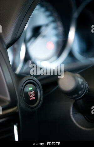 modern car engine start and stop button Stock Photo