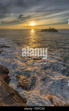 Sunlight over Surf, Godrevy Lighthouse, St Ives Bay, Cornwall, UK Stock Photo