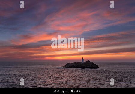 Sunset over Godrevy Lighthouse, St Ives Bay, Cornwall, UK Stock Photo