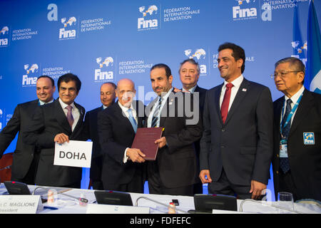 Budapest, Hungary. 31st Jan, 2016. FINA President Julio Maglione (2nd L, front) and Thani Abdulrahman Al-Kuwari (2nd R, front), secretary general of Qatar's Olympic Committee, pose for photograph after Doha, capital of Qatar, was announced as the host city of the 2023 World Aquatics Championships at a press conference in Budapest, Hungary, on Jan. 31, 2016. © Attila Volgyi/Xinhua/Alamy Live News Stock Photo