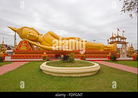 A golden reclining buddah in Vientiane, Laos Stock Photo