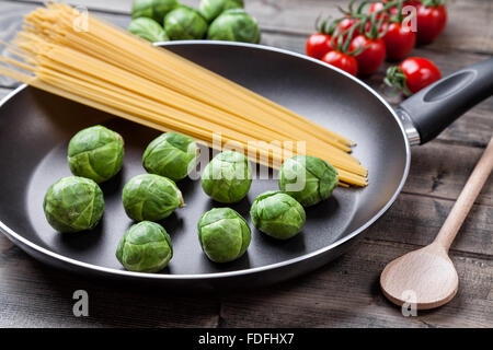 Fresh and healthy organic brussel sprouts in a frying pan Stock Photo