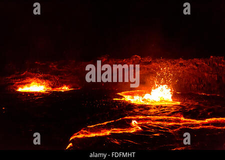 Lava bubbles burst on the surface of the Erta Ale lava lake, Ethiopia Stock Photo