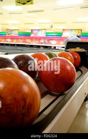 Bowling balls at the ball return at a 10-pin bowling alley Stock Photo