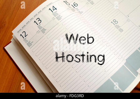 Web hosting text concept write on notebook with pen Stock Photo