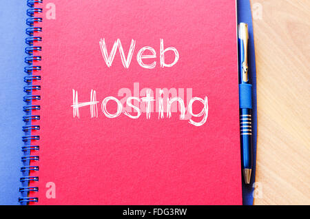 Web hosting text concept write on notebook with pen Stock Photo
