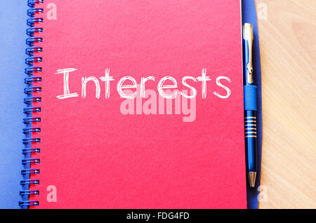 Interests text concept write on notebook with pen Stock Photo