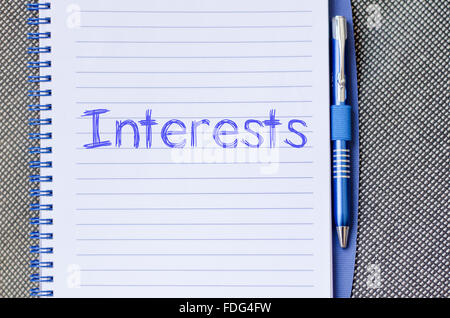 Interests text concept write on notebook with pen Stock Photo