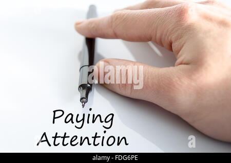 Paying attention text concept isolated over white background Stock Photo