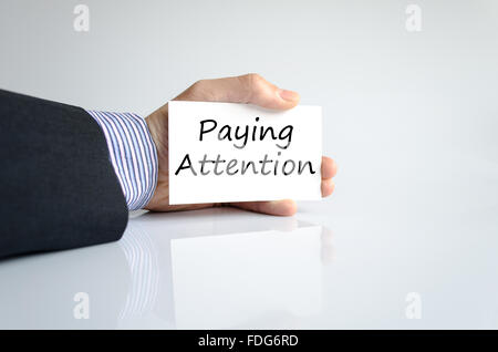 Paying attention text concept isolated over white background Stock Photo