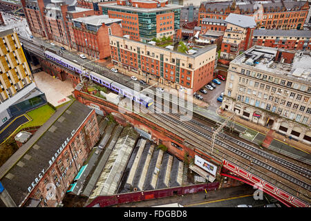 Manchester a local Northern Rail service leaves Manchester Oxford Road railway station on a wet day  rain damp weather tracks hi Stock Photo