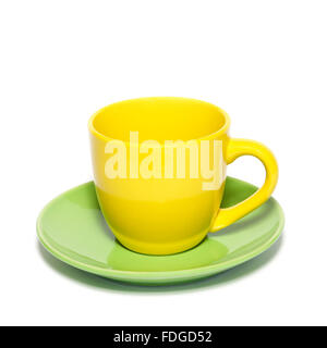 Colored teacup and saucer isolated on white. Stock Photo