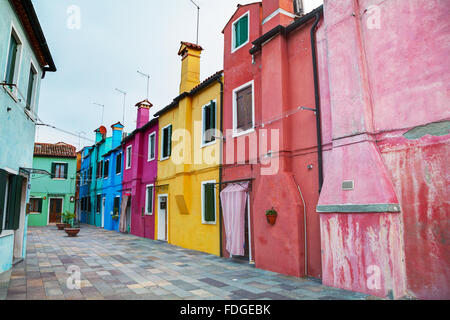 BURANO, ITALY - NOVEMBER 23: Brightly painted houses on November 23, 2015 in Burano, Venice, Italy. Stock Photo