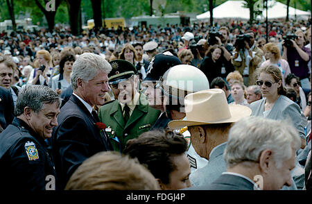 Washington,DC., 15th May, 1995 President William Clinton attends the annual Police Memorial on Capitol Hill. Clinton speaks with constable from England Credit: Mark Reinstein Stock Photo