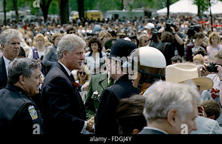 Washington, DC., USA, 15th May, 1995 President William Clinton attends the annual Police Memorial on Capitol Hill. Clinton talks with constable from England  Credit: Mark Reinstein Stock Photo