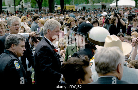Washington, DC., 15th May, 1995 President William Clinton attends the annual Police Memorial on Capitol Hill. Clinton speaks with Constable  from England Credit: Mark Reinstein Stock Photo
