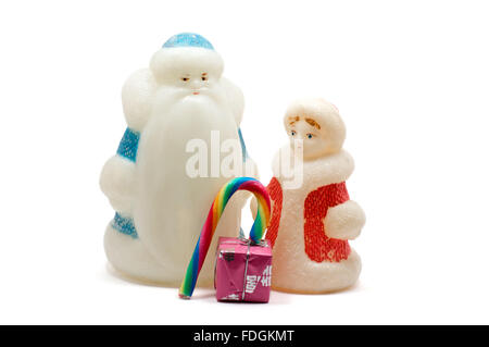 Isolated figures of Ded Moroz and Snegurochka over white Stock Photo