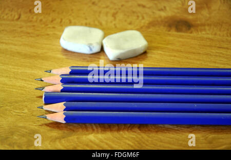 seven blue pencils and two erasers Stock Photo