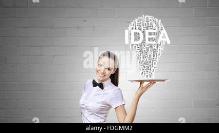 Pretty woman holding tray with successful idea concept Stock Photo