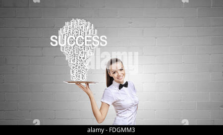 Pretty woman holding tray with successful idea concept Stock Photo