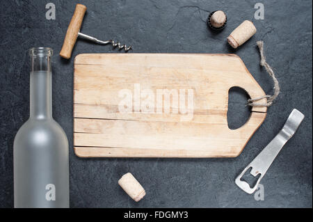 Empty board and empty bottle on the stone table Stock Photo