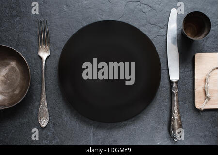 Cutlery setting in the dark colors Stock Photo