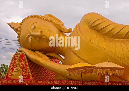 Reclining golden buddah in Pha That Luang, Vientiane, Laos Stock Photo