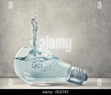 Glass light bulb filled with clear water and businessman inside Stock ...