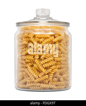 Rotini Pasta in a Glass Apothecary Jar. The image is a cut out, isolated on a white background. Stock Photo