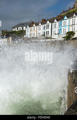 Waves crashing against the harbour wall at Porthleven, Cornwall, England, UK Stock Photo