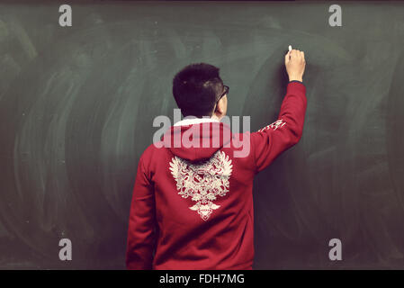 A man write on the blackboard Stock Photo