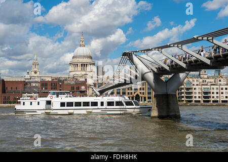 A ferry passing St. Paul's Cathedral on the River Thames in London, England. Stock Photo
