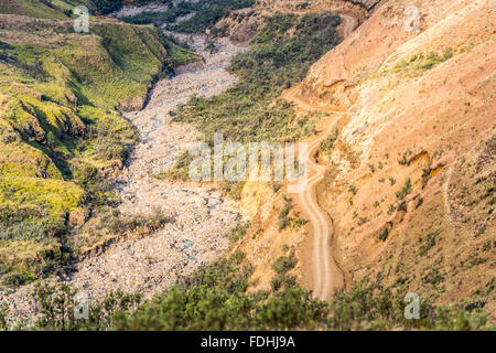 Empty dirt road winding down a mountain in Sani Pass, between South Africa and Lesotho. Stock Photo