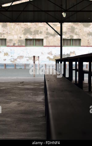 Wooden bench in prison yard at Fremantle Prison, Western Australia Stock Photo