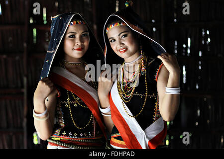 Kota Kinabalu, Malaysia - May 30, 2015: Dusun Tobilung lades pose for guests during the State Harvest Festival Celeberation in K Stock Photo