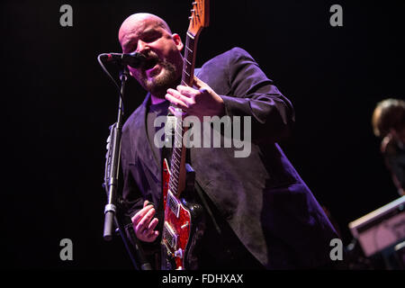 Alain Johannes singing and playing guitar Stock Photo