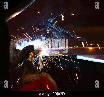 Welder working in a factory Stock Photo