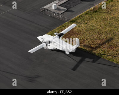 Single Engine Airplane on a airport runway ready for taking off Stock Photo