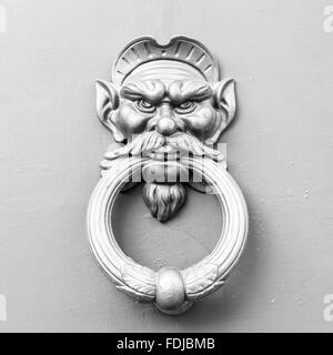 Ornamental handle of an old door in Rome Stock Photo