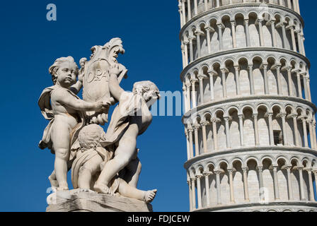 Pisa, Italy. The Leaning Tower with a statue in foreground Stock Photo