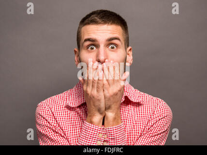 Man covering his mouth Stock Photo