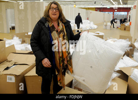 Bremen, Germany. 01st Feb, 2016. Bremen's Anja Social Senator Stahmann (Alliance 90/The Greens) visits a hardware store which has been turned into a refugee shelter in Bremen, Germany, 01 February 2016. A group of 350 refugee is expected to move into the hall which has been seperated into rooms in the coming days. Photo: Ingo Wagner/dpa/Alamy Live News Stock Photo