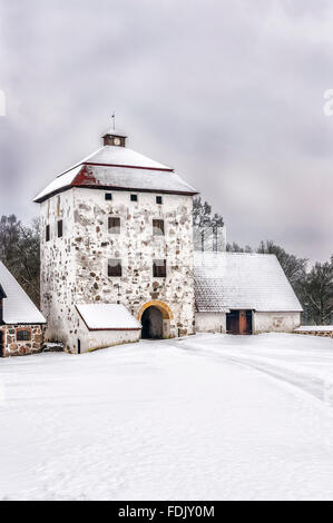 View of a snow covered Hovdala Castle in Hassleholm region. Hovdala Castle is a castle in Hassleholm Municipality, Scania, in so Stock Photo