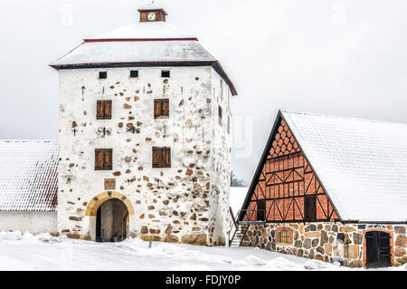 View of a snow covered Hovdala Castle in Hassleholm region. Hovdala Castle is a castle in Hassleholm Municipality, Scania, in so Stock Photo