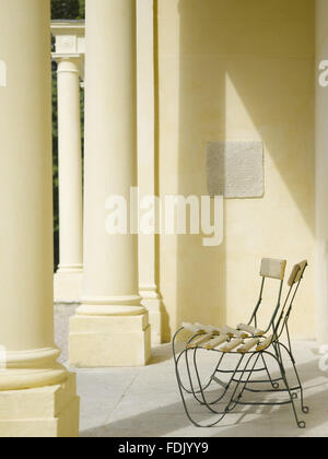 Garden chairs on the loggia at the side of the house at Greenway, Devon ...