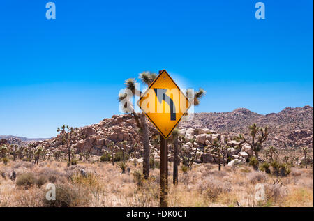 Curve Warning Sign in the desert, USA Stock Photo